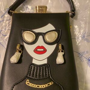 Chic Black Designer Handbag with Artistic Face Design